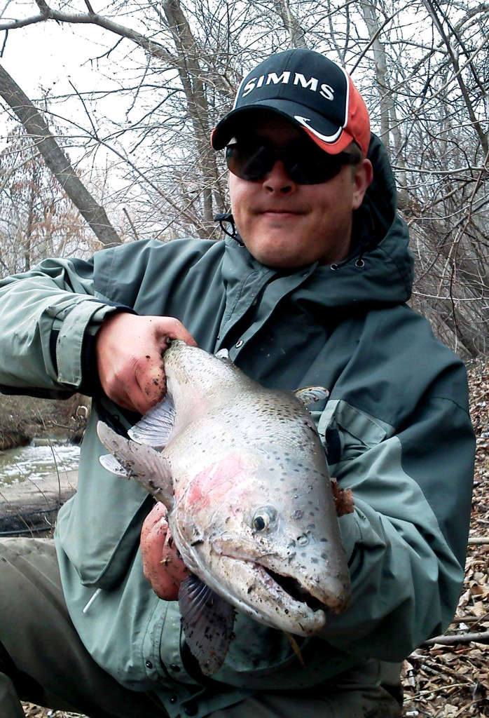 The author with one of many late winter steelhead he catches from the Wisconsin tributaries. 