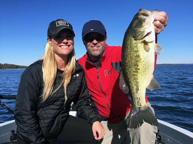 Pro bass angler Mandy Ulrich and TV host Steve Pennaz hoist the spoils of fishing jerkbaits in cold water.